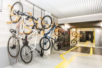 Photograph bicycles hanging on rack on the wall