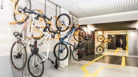 Photograph bicycles hanging on rack on the wall