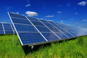 A photograph of solar panels in a field